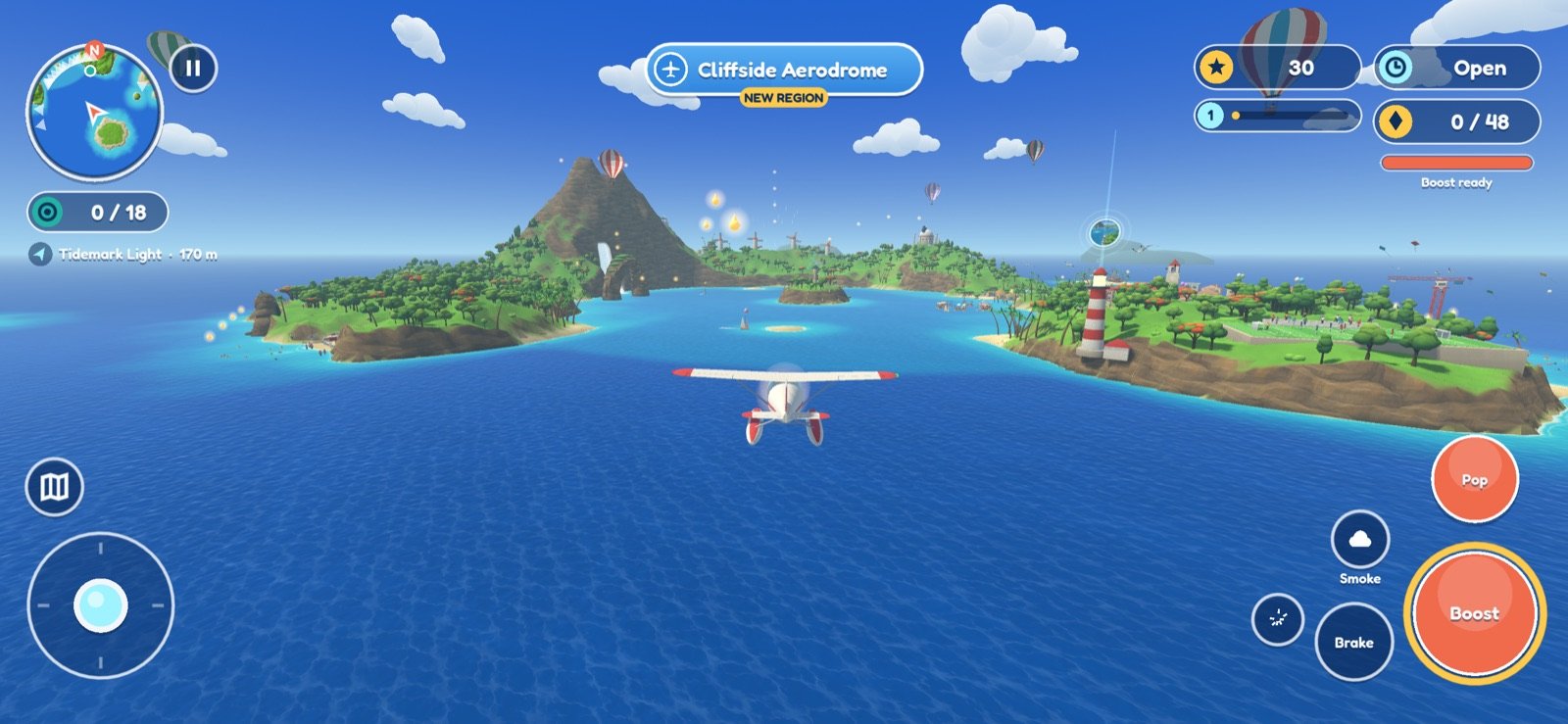 A red seaplane flying toward a volcanic island over a blue sea